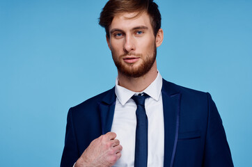 handsome man in suit self-confidence official blue background