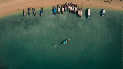 Top view of long tail boat on the beach in ao nang krabi Thailand.
