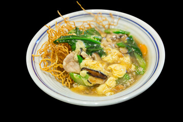 Die cut of Crispy fried noodle pork with Gravy Sauce.