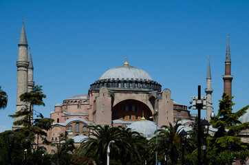 Fototapeta na wymiar Hagia Sophia Mosque with trees and palms in the spring