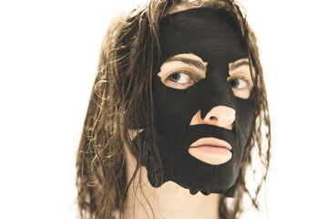 A woman with a skin mask in front of a white background