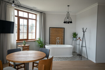 Bright room with wooden table and wash tube