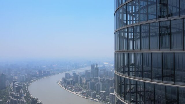 Drone aerial view of modern skyscraper and Shanghai downtown skyline. Epic closeup view of Lujiazui building. Business economy travel concept b-roll footage office building exterior with modern design