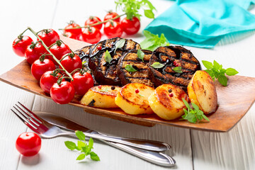 Delicious eggplant steaks with vegetables.