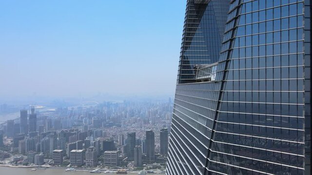 Drone aerial view of modern skyscraper and Shanghai downtown skyline. Epic closeup view of Lujiazui building. Business economy travel concept b-roll footage office building exterior with modern design