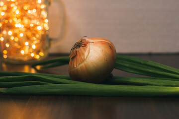 Fresh green onion, ripe sweet tomato and onion head, close-up. Ingredients for making a salad for lunch. Fresh vegetables from the farmers ' market. Vegetarian food. Background with food