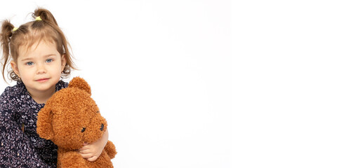 Portrait of little girl with teddy bear copy space banner