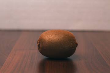 Unpeeled kiwi fruit on the table. An ingredient for making a cake. Organic food