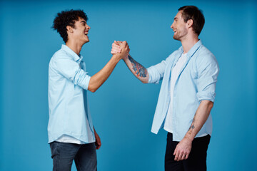 good friends in shirts on a blue background communication greeting party