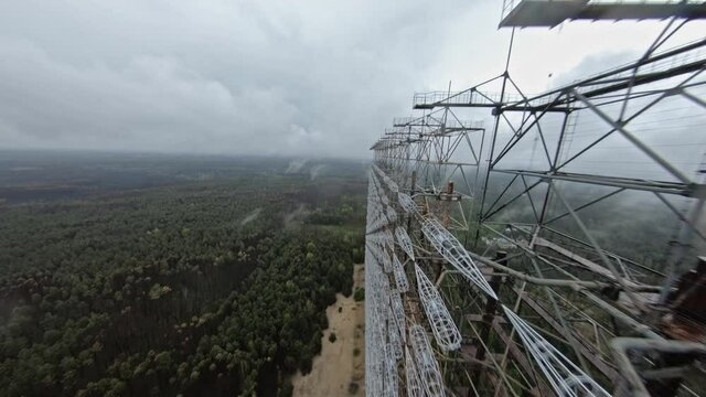 FPV drone view of over horizon duga radar system in the rain. The Chernobyl Exclusion Zone