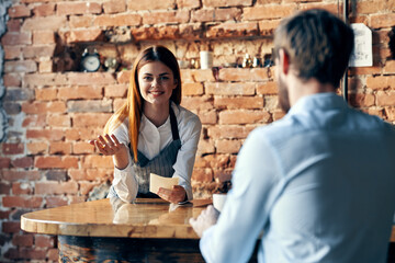 Fototapeta na wymiar female waiter next to customer service lifestyle work