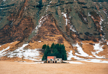 Shabby shack on snowy mountain