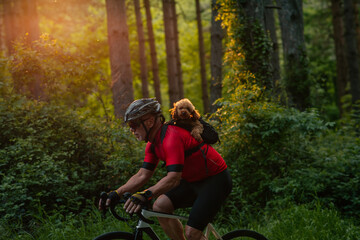 Fototapeta premium Man on bike tour with his puppy