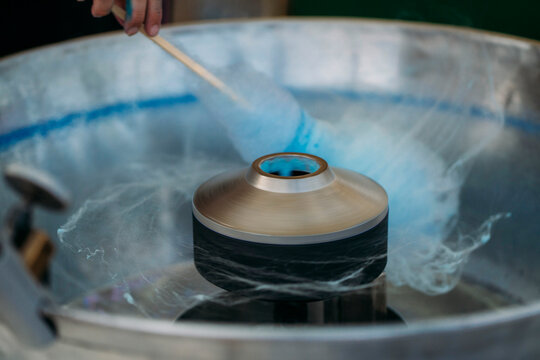 Unrecognizable person preparing the cotton candy machine