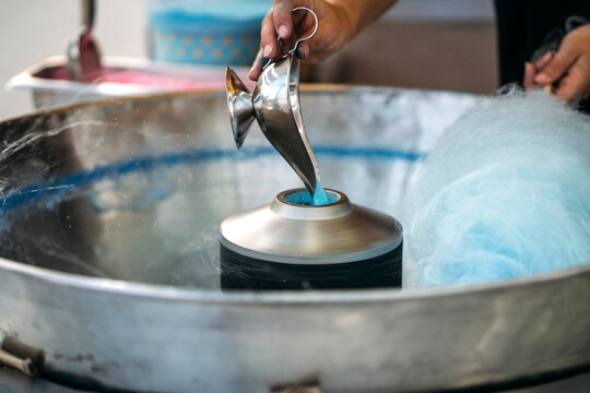Unrecognizable person preparing the cotton candy machine