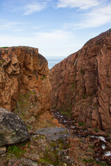 Landscapes of the Murmansk region. Waterfall on Small Battery Lake, Teriberka, Russia.