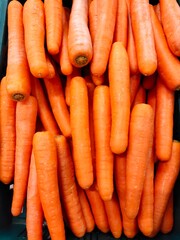 Carrots in a supermarket on blur background