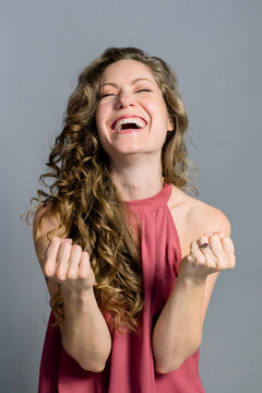Attractive charming woman with hands up
