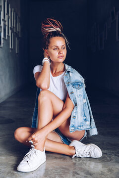 Positive woman posing in room