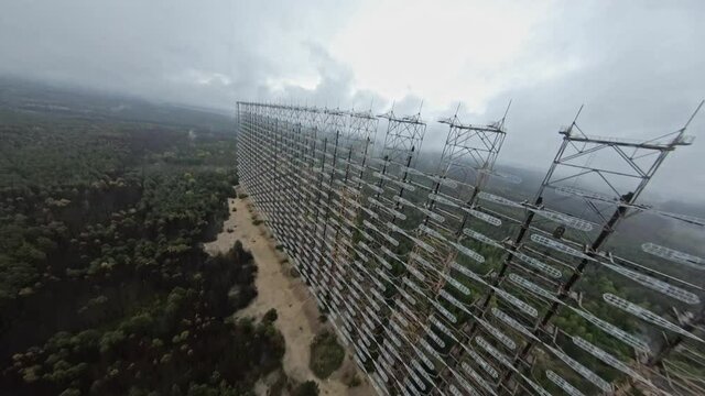 FPV drone view of over horizon duga radar system in the rain. The Chernobyl Exclusion Zone
