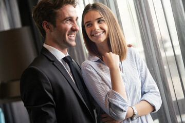 Happy satisfied couple looking and planning their future, vision