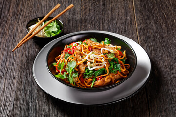 grilled soy meat strips with egg noodle in a bowl