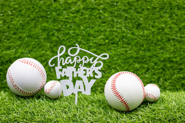 Happy Father's Day to Baseball player on green grass background