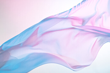 Smooth elegant colorful transparent cloth separated on white background. Texture of flying fabric. - obrazy, fototapety, plakaty