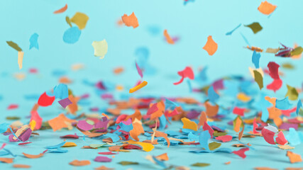 Fototapeta na wymiar Color confetti falling on pastel blue background, macro shot.
