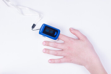 Doctor hand in white medical latex gloves hold patients hand with pulse oximetry on the finger. Noninvasive and painless oxygen saturation level test. Part of set.