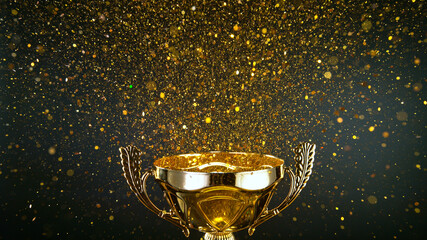 Champion golden trophy isolated on black background. Concept of success and achievement. Gold glitters explosion. - obrazy, fototapety, plakaty