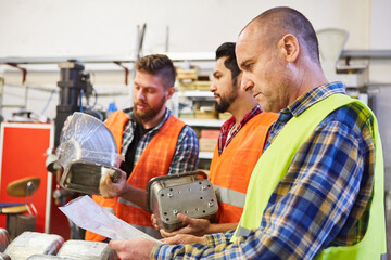 Order picker checks incoming goods with checklist