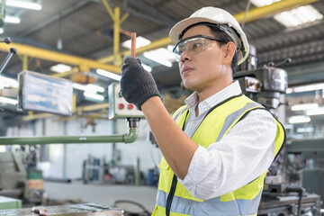 A technician or engineer is inspecting copper pipes in the refrigeration industry.