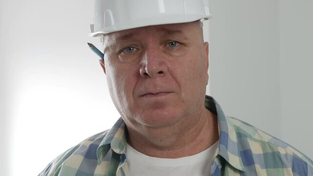 Constructor Portrait Working in Building Industry Staying Tired and Bored in Front of a Camera.
