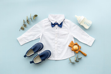 Bodysuit shirt and shoes for baby boy. Baby flat lay background