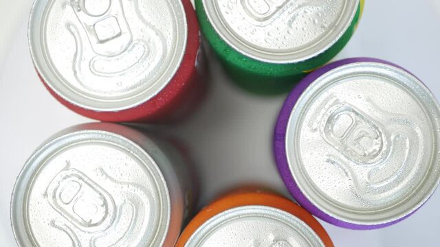 Various Cold, Sweet, and Acidulated Refreshing Drinks. Shooting with Refreshing Soda Pop Can Drinks.