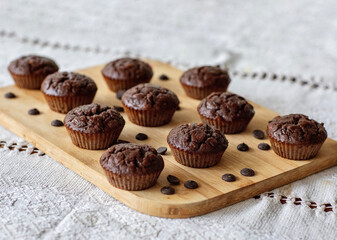 Homemade chocolate muffins on a wooden table