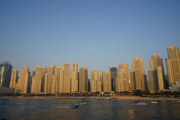 Fototapeta na wymiar Sunset view on buildings in Dubai Marina