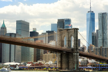 Famous Brooklyn bridge on the background of skyscrapers of Manhattan. Postcard view of New York,...