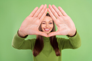 Photo portrait happy woman showing border triangle with palms isolated pastel green color background