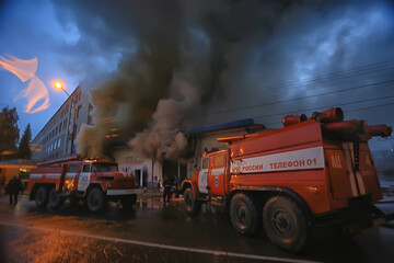 Vologda, Russia - September 16: Fire red truck night city fire, smoke, emergency, September 16, 2017 Vologda, Russia