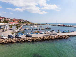 Fototapeta na wymiar Ships and yachts at the sea port marina of Sveti Vlas in Bulgaria. Aerial photography, drone view. Summer holidays in Europe during quarantine