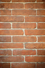 Obraz premium Old brick wall texture. The wall, made of old red bricks, darkened by old age. Ancient vintage background. Brick wall