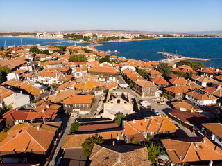 Fototapeta premium Aerial view of the center of old Nessebar, houses, churches. Drone view from above. Summer holidays destination