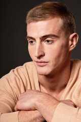 Obraz premium Portrait of thoughtful handsome young man posing in studio