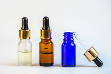 Naklejka premium A bottle with a pipette for essential oils