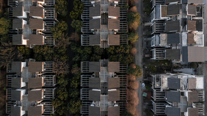 Top down aerial drone view on parallel streets of residential district and duplex cottages in row...