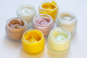 Cream in a jar on a white background