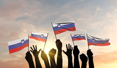 Silhouette of arms raised waving a Slovenia flag with pride. 3D Rendering - obrazy, fototapety, plakaty