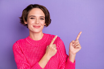 Photo of young woman happy smile indicate fingers empty space ad promo recommend suggest isolated over violet color background